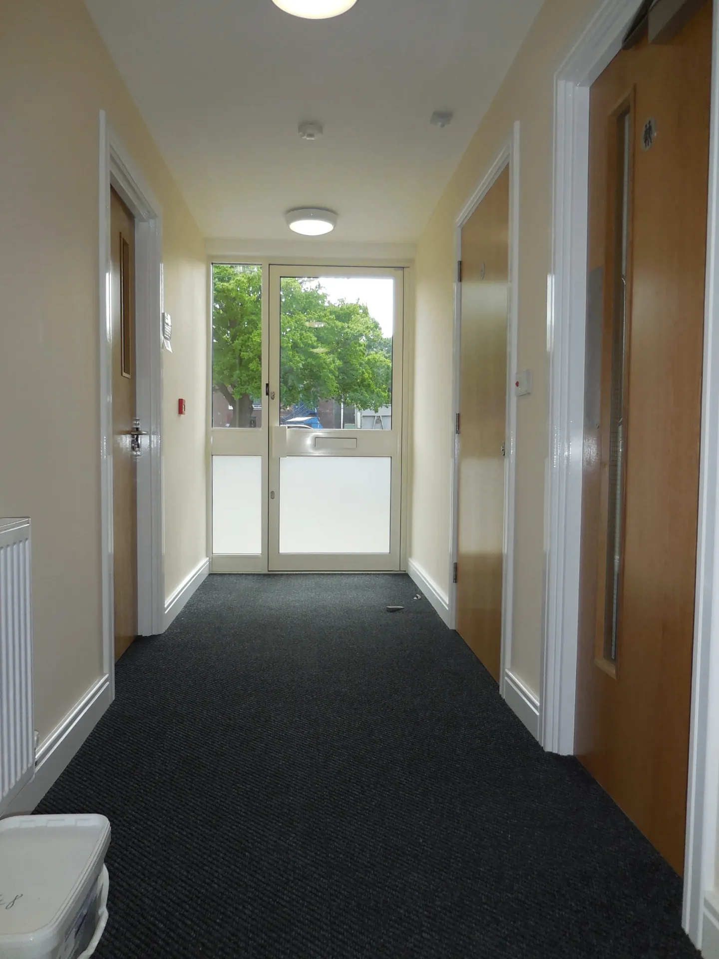 Composite House entrance lobby with carpeted hallway
